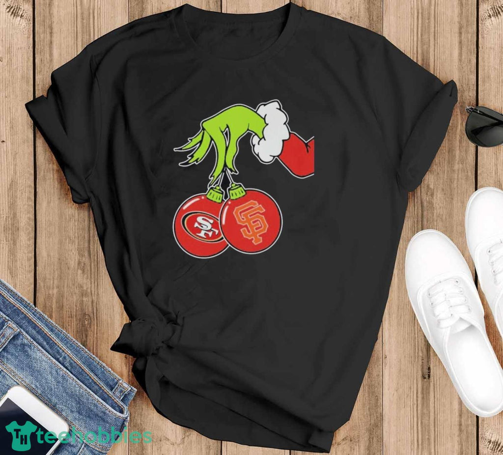The Grinch Hand holding ornament San Francisco Giants and 49ers logo Christmas shirt
